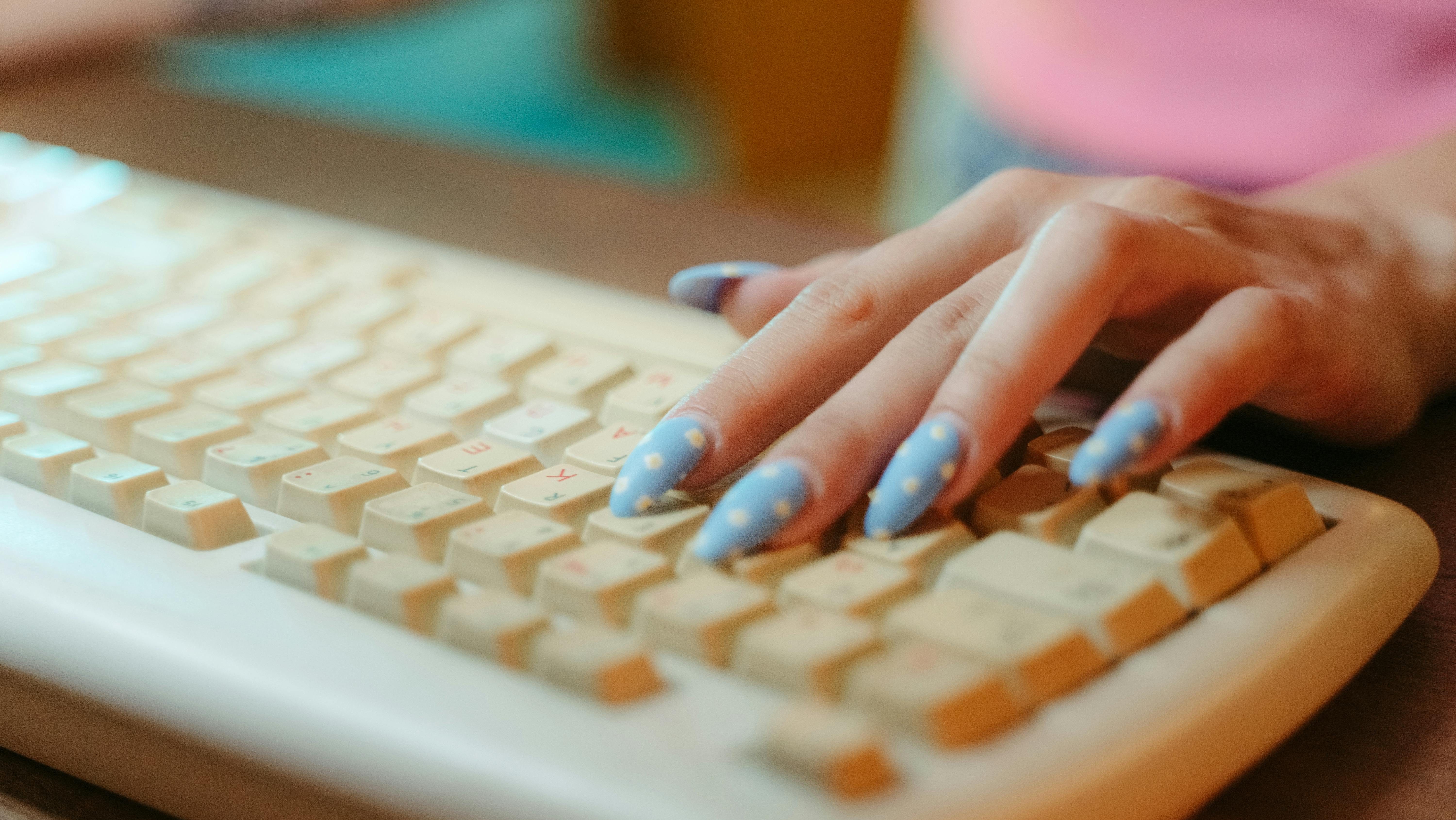 Person providing website copywriting services by typing on a keyboard